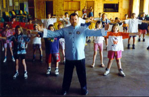 Allan leads a group of students through Chi Kung exercises
